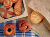Speelgoed - imitatievoeding - Yellow Door Sensory Play Stones Breads of the World - gebak - set van 8